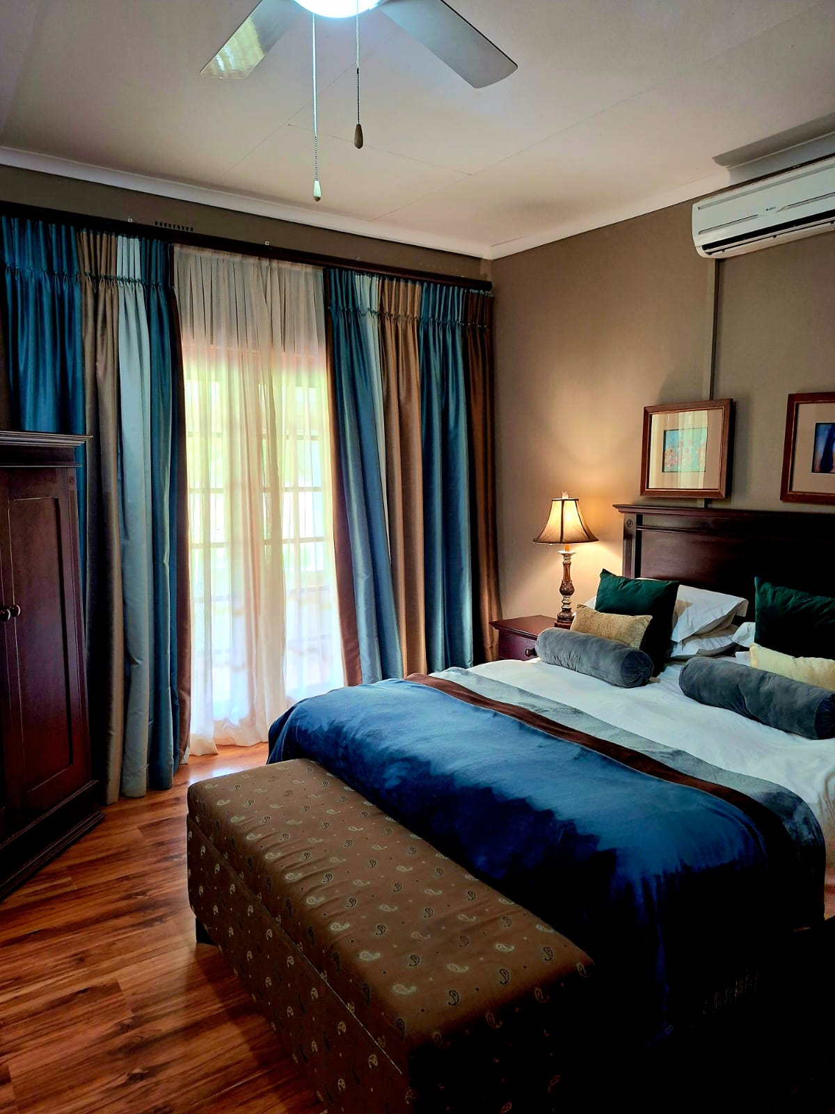 Sage Suite bedroom with soft blue bedding